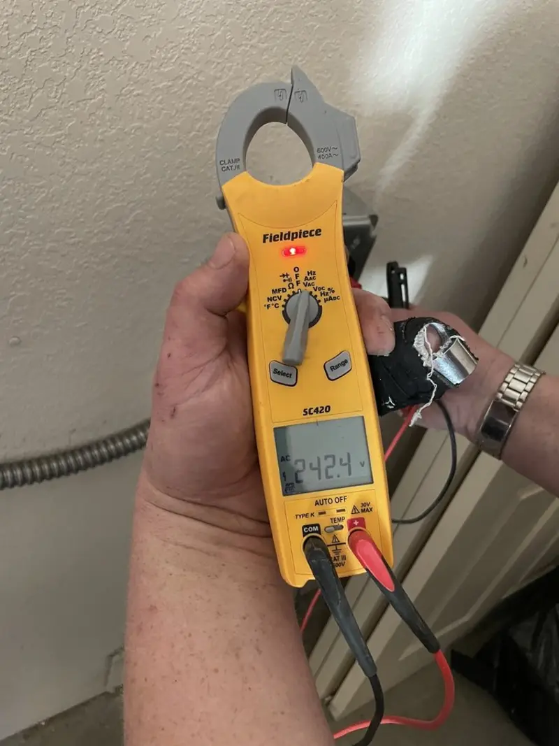 Voltage testing with clamp meter during Recessed Lighting Installation in Selma